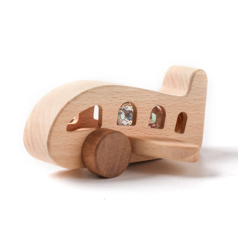 Wooden toy airplane with gemstone windows and rolling wheels, labeled 2PCS