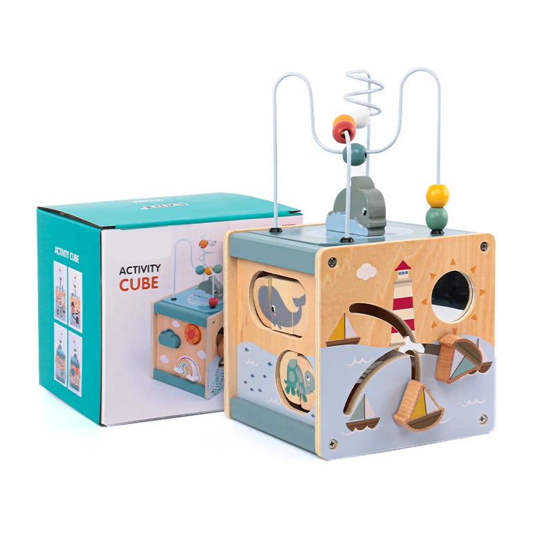 Wooden activity cube toy with nautical designs, bead maze, and colorful box packaging