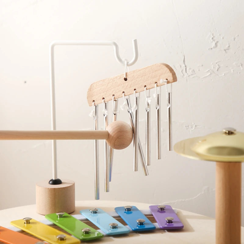 Wooden musical toy with chimes, colorful xylophone keys, and a small cymbal